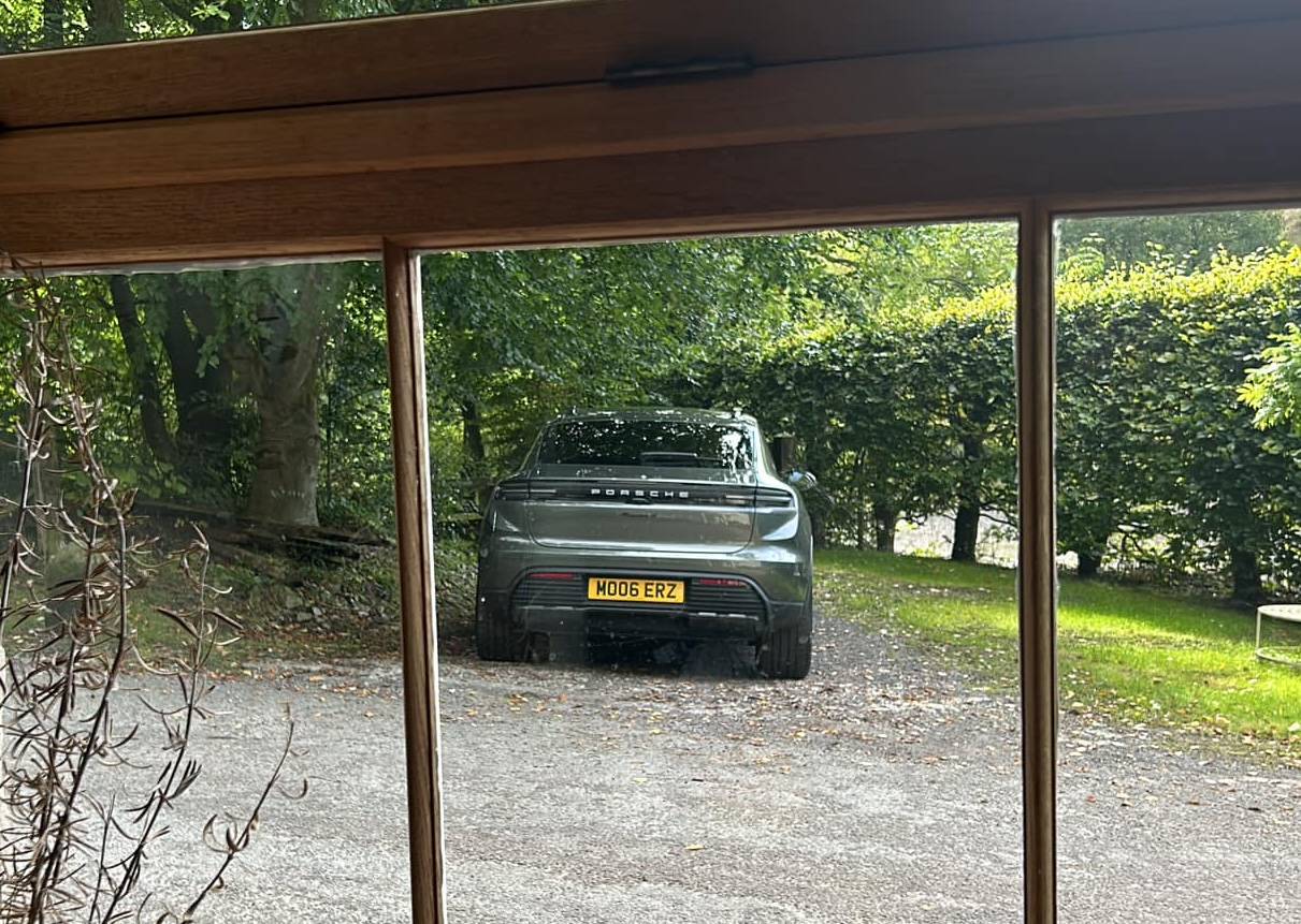 Aventurine Green Macan EV with OffRoad Package + Black Roof Rails