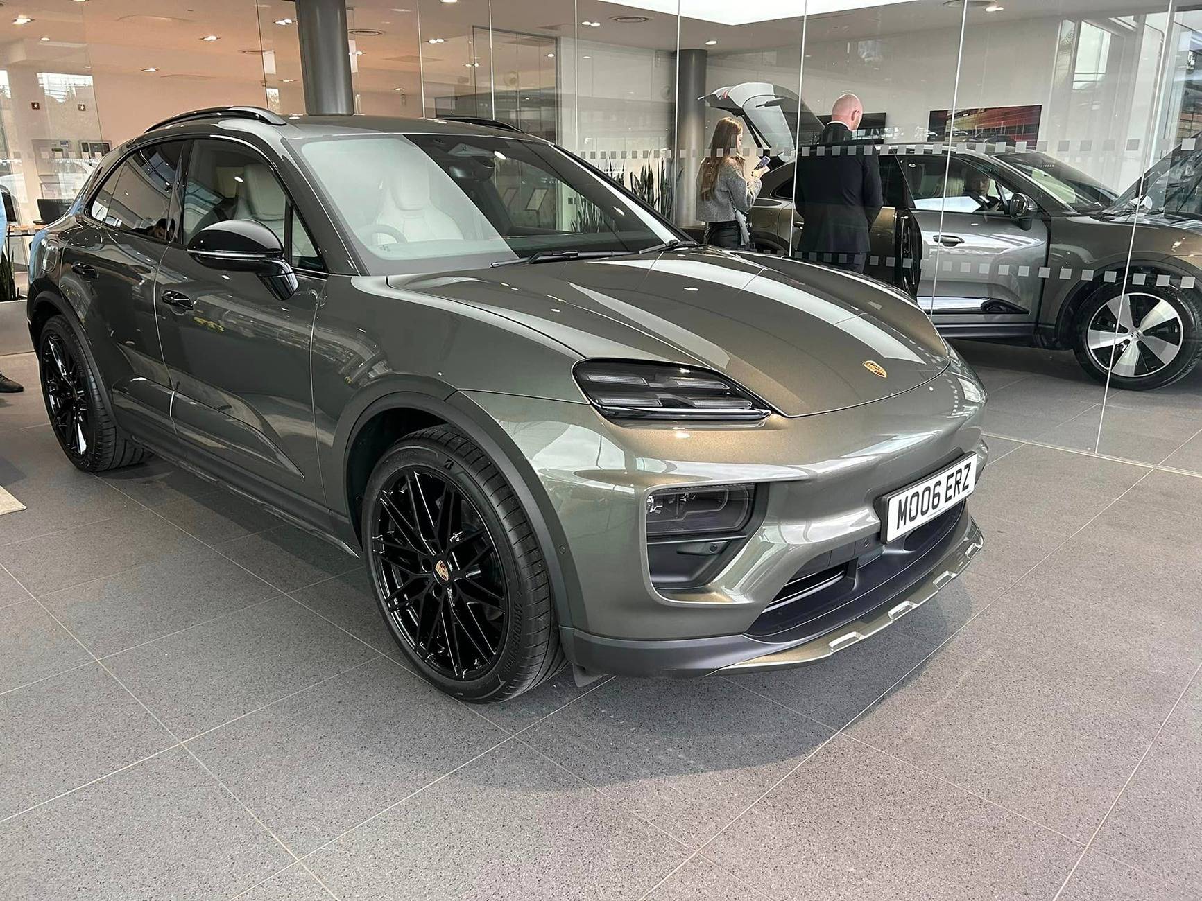 Aventurine Green Macan EV with OffRoad Package + Black Roof Rails